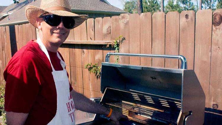 Man using grill.